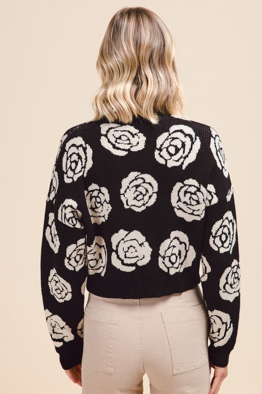 Black sweater with white flowers