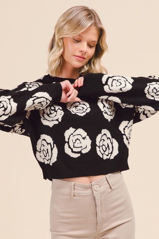 Black sweater with white flowers