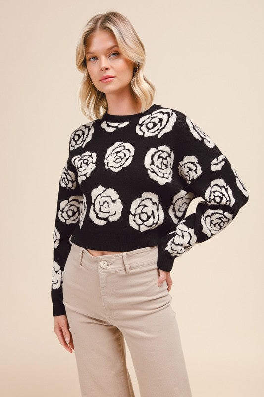 Black sweater with white flowers